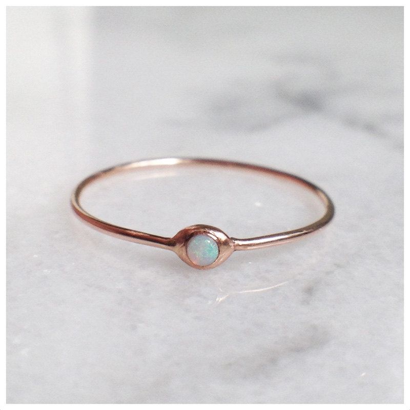 A droplet of opal set in a whisper-thin band of gold.