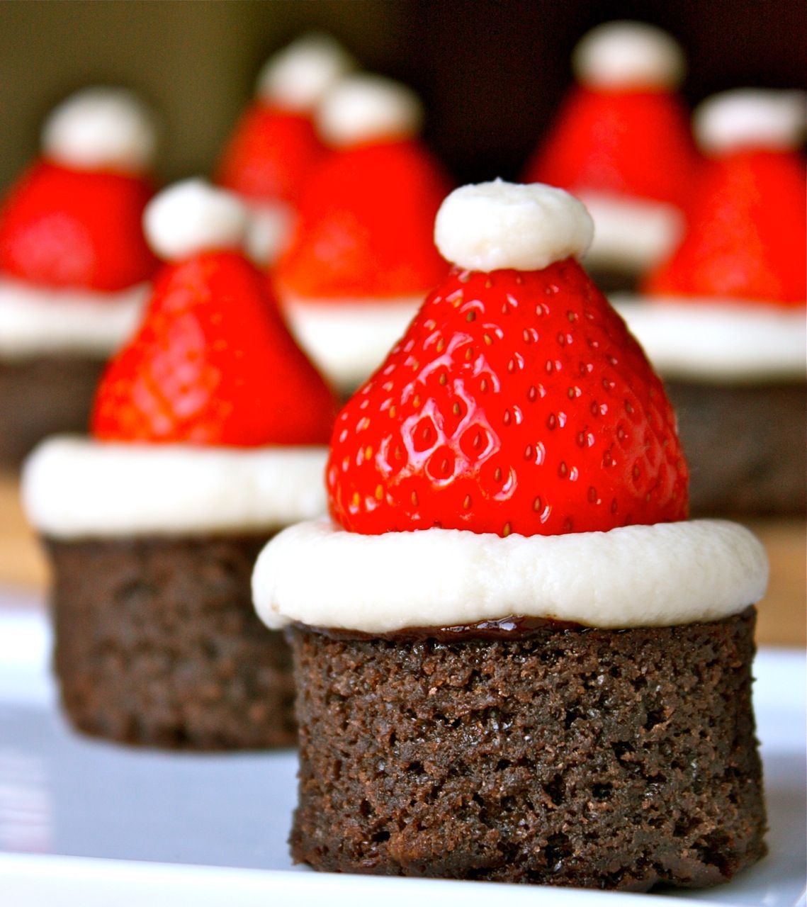 A festive way to dress up brownie bites: Santa Hat Brownies.
