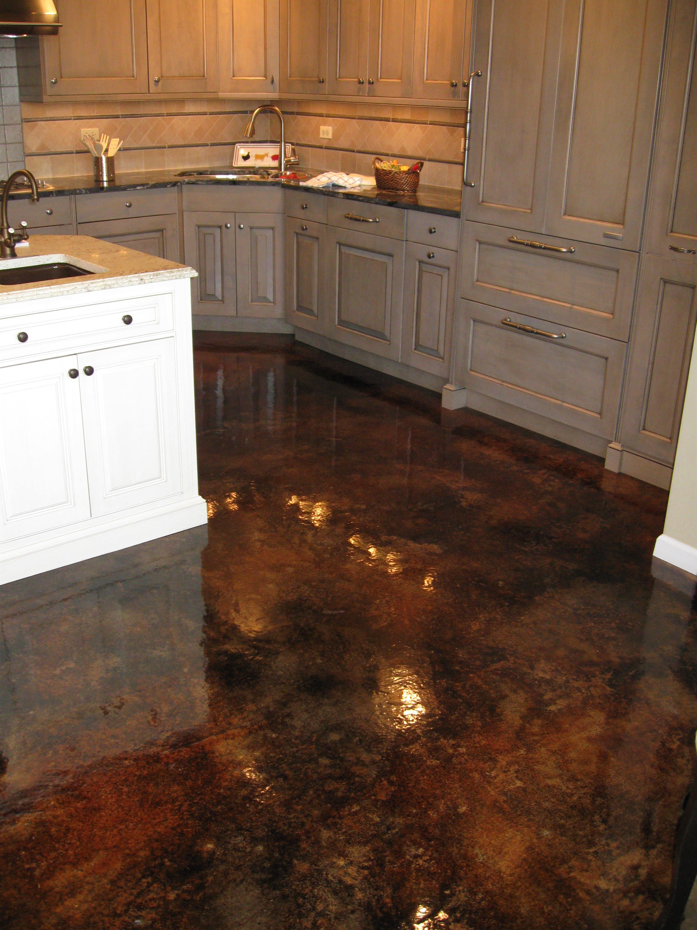 Acid Stained Concrete with High Gloss. No grout to clean and blends with Wood Fl