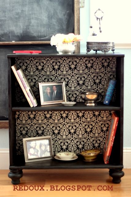 Add feet and wallpaper to a cheap bookcase – fancy.