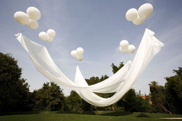 BEST IDEA EVER! Floating canopy: the balloons are attached to the ground with fi