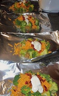 Chicken broccoli, ranch, cheese, and bacon in aluminum foil and placed in the ov