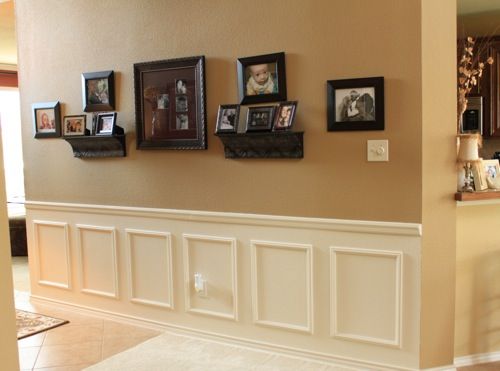 DIY wainscoting: Use wooden appliques (chair rail and squares) to create a faux