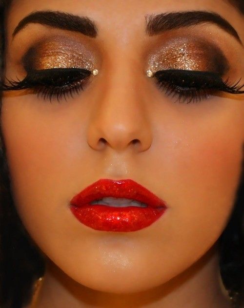 Dramatic make-up: gold sparkly eyes and red lips