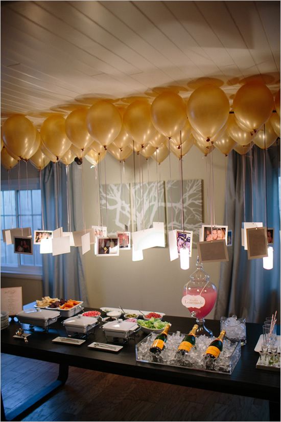 Engagement party idea: photos hanging from balloons to create a chandelier over