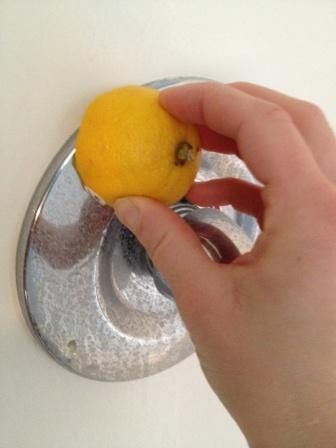 Erase hard water stains with a lemon and other tips to naturally clean your bath