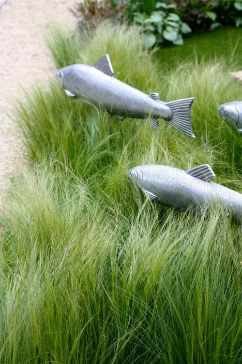 Fishes in a sea of grass, cool use of garden sculpture.