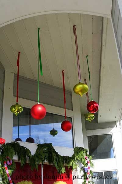 Hang Christmas bulbs from front porch