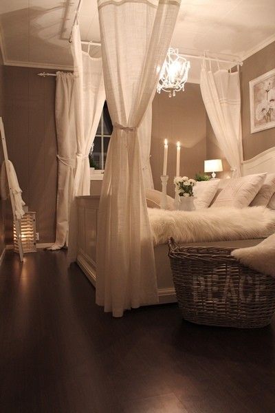 LOVE the faux canopy bed using curtain rods on the ceiling! Perfect.
