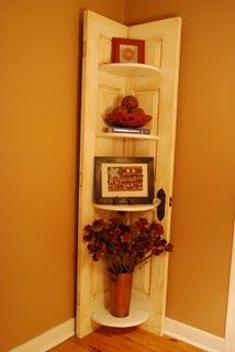 Old door, cut in half, and then reassembled as a corner shelf.  I really like th