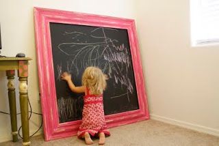 Paint a large, cheap piece of wood with chalkboard paint and frame with molding.
