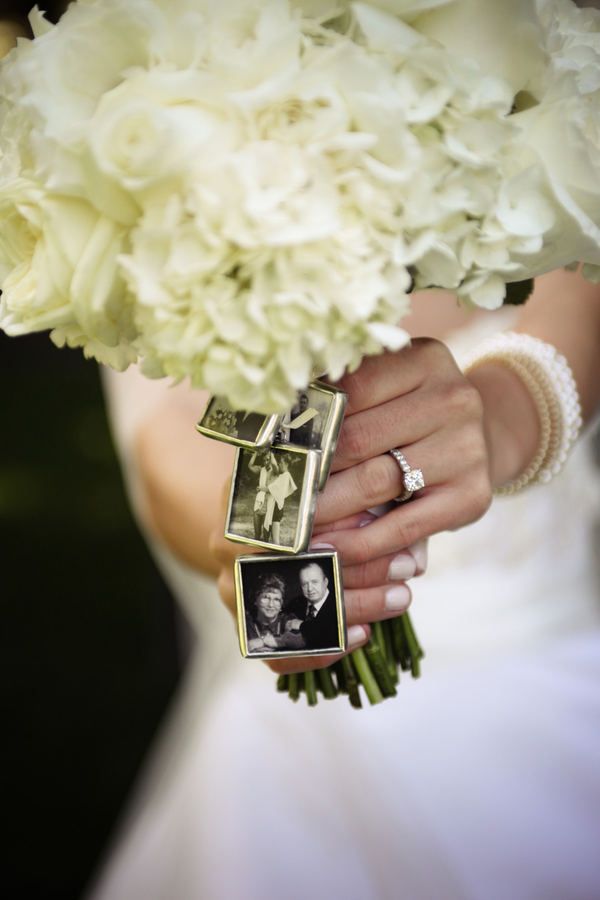 Photo charms attached to this bride's bouquet.  For those in heaven that can