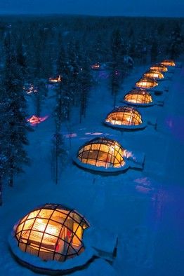 Renting a glass igloo in Finland to sleep under the northern lights.