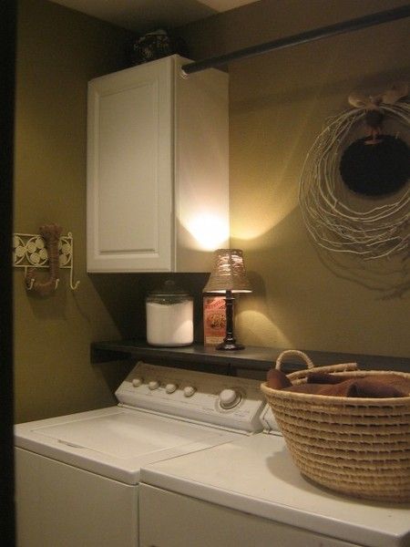 SMART!! Add a ledge above the washer/dryer to keep stuff from finding their way
