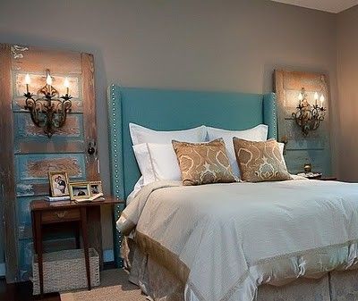 Salvaged doors with wall sconces. Gasp! Great idea if you don't want to cut