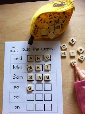 Scrabble letters to build first words.