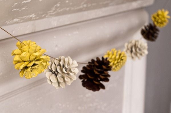 Spray paint pine cones different colors to create a colorful pinecone garland.