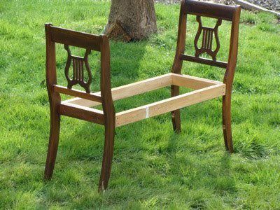 Take the backs of two antique chairs & make a bench, awesome for the foot of