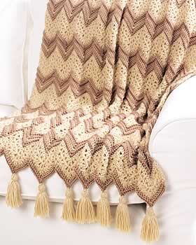 This #crochet ripple afghan pattern calls for elegant beige colors and fancy tas