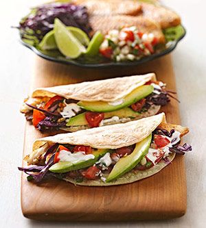 Tilapia Tacos – Mild flaky fish, colorful slaw, avocado and a creamy greek yogur