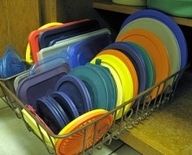 Use a dish drain from the dollar store to organize plastic lids. Seriously, this