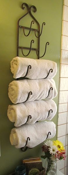 Use a wine rack as towel holder in bath.