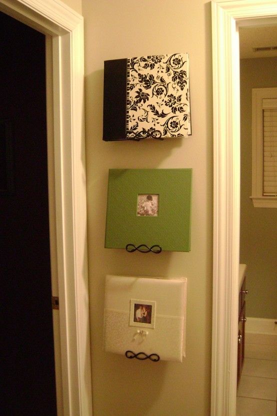 Use plate hangers to display photo albums on the wall so you (and friends &