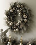 What a beautiful wreath for Christmas.  Using all silver and green is so special