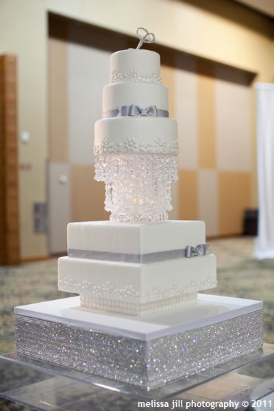 White wedding cake with silver.