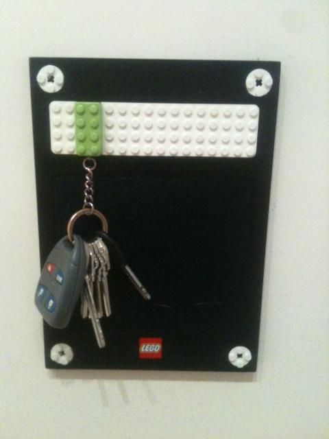 Your keychain has a lego on it.. snap it into place. I need this!