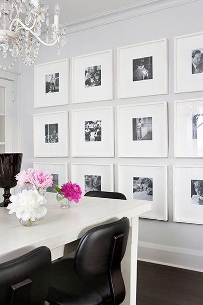 black and white photos covering wall