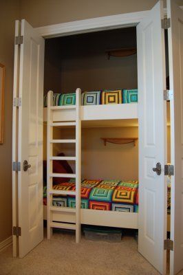 bunks in the closet, leave the rest of the room as a play area. So cool!!