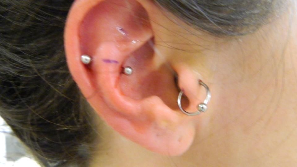 halfway between a rook and a snug. from Only Precision Piercing in Washington SO