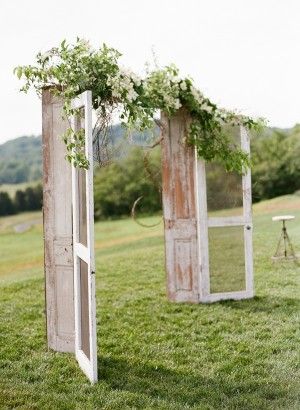 i love this idea for your arch! just buy two really old doors or else just by do