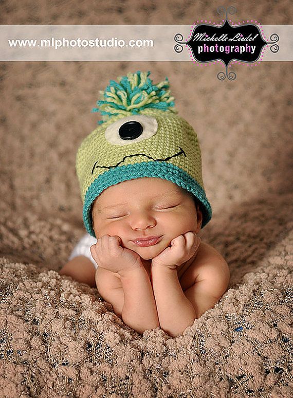 not only is the baby SOOO adorable, but he has a mike hat from monsters inc!!