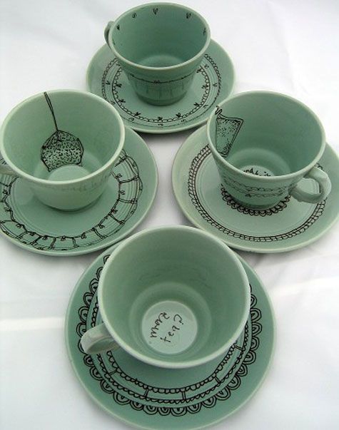 thrift store cups with ceramic ink line drawings