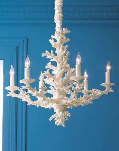 A coral chandelier against a blue wall – simply fabulous!