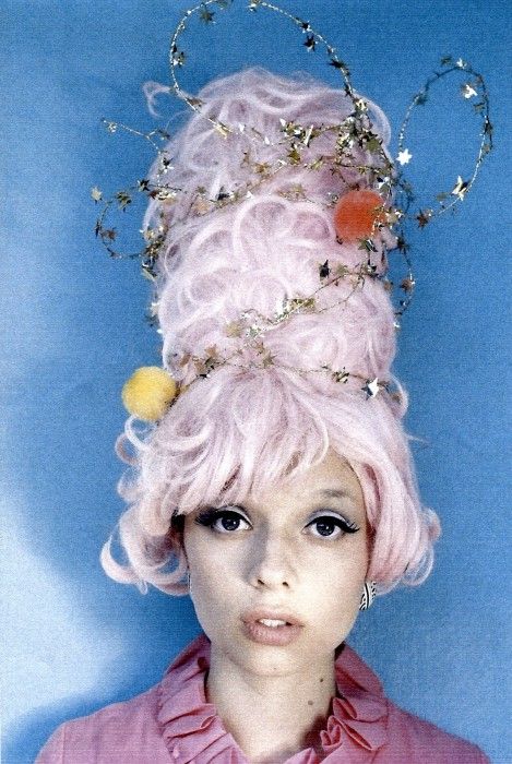 Epic Halloween hair: a cotton candy beehive wrapped in tinsel stars.