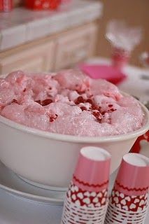 Fluffy punch: 7-UP, cranberry juice, raspberry sherbet and frozen raspberries to