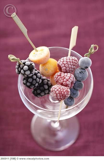 Frozen fruit skewers…pour champagne and serve with one skewer.