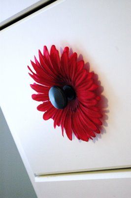 I LOVE this idea !!!!!! Add silk flowers behind the knob. Cute for a little girl