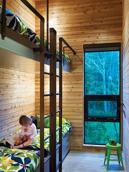 In a narrow kids' room, an intentionally high upper bunk creates an airy atm