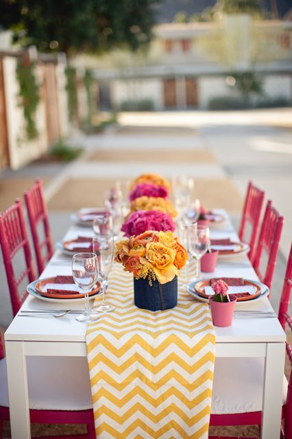 Love this yellow chevron table runner with the pink chairs