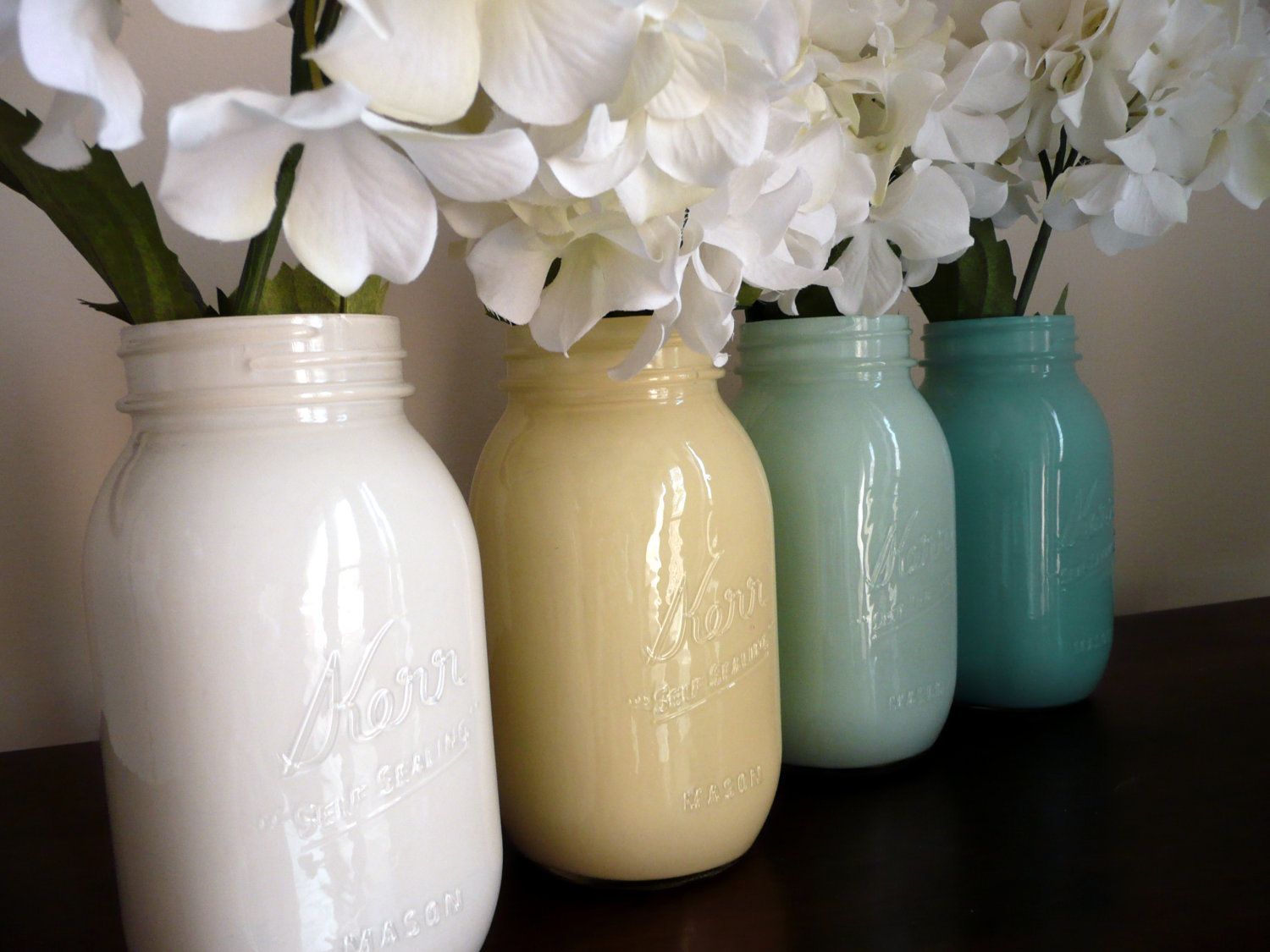 Painted Mason Jar Vases ~ Pour paint into a clean mason jar, rotate until inside