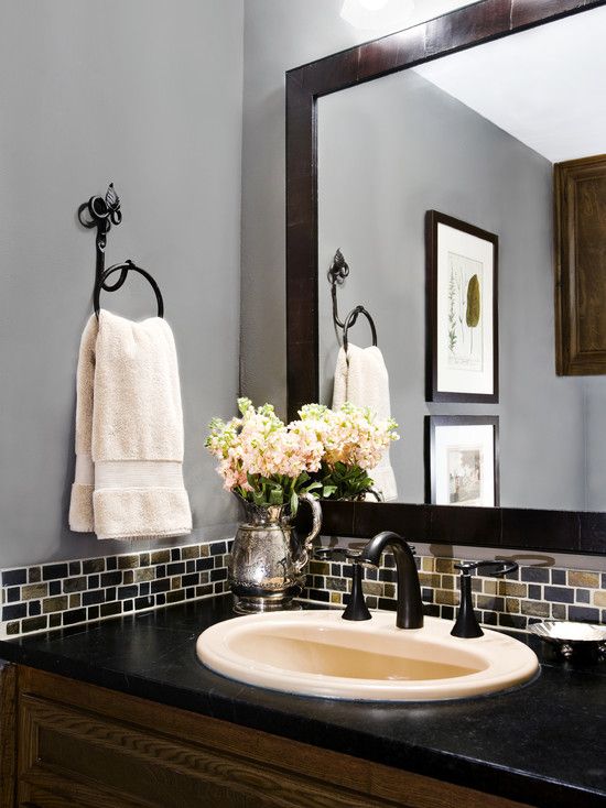 Small band of glass tile is a pretty AND cost-effective backsplash for a bathroo