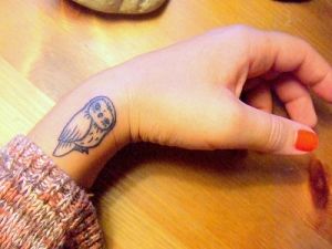 owl wrist tattoo