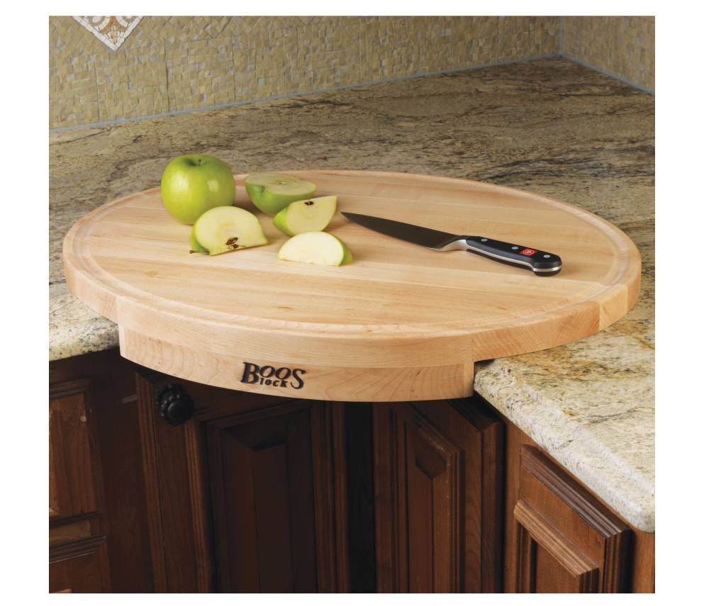 Cutting board fits at corner of counter.