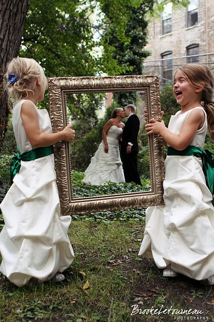 Flower girls (could be a ring bearer) framing the couple :)