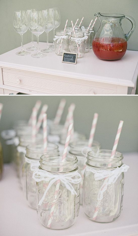 Mason jar glasses with pink striped straws and lace bows