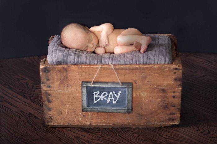 Newborn baby photography with rustic props